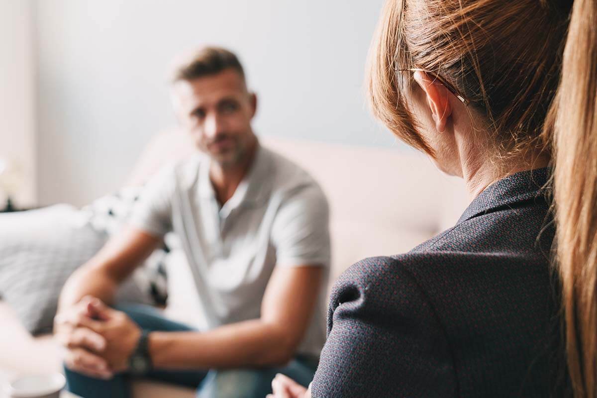 Is Residential Addiction Treatment Right For Your Parents woman discusses residential addiction treatment with father